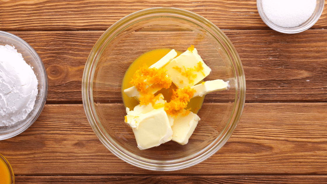 Add butter, zest, and orange juice to mixing bowl.