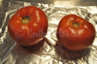 Place tomatoes on baking sheet and broil in oven.