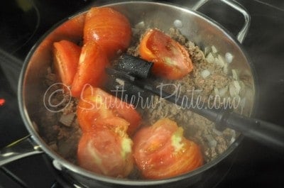Add tomato wedges to skillet.