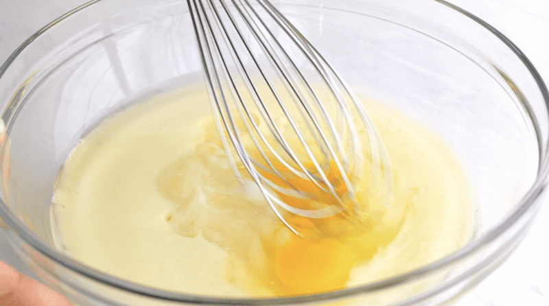 In a separate bowl, mix together the sugar, buttermilk, apple cider vinegar, and eggs.