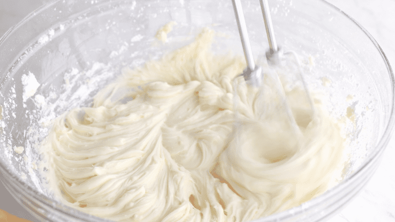 Making the cream cheese frosting.