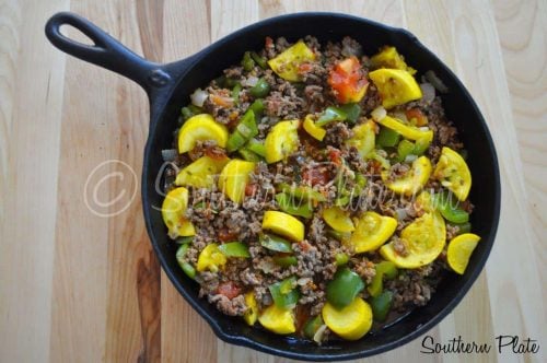Ground beef and vegetables in skillet.