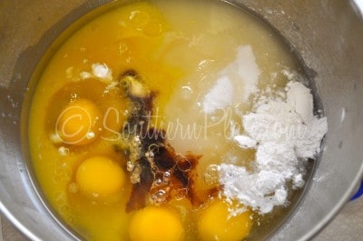 Place sugar, flour, eggs, baking powder, oil, vanilla, and orange juice in a large bowl.
