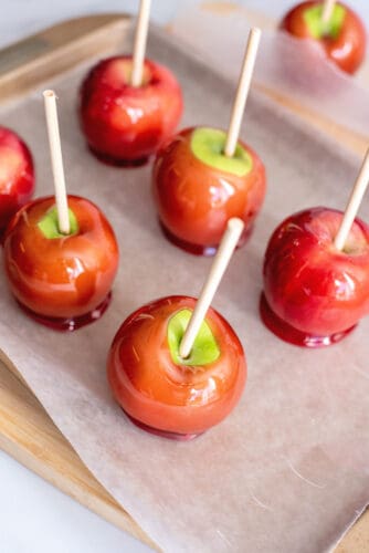 Candy apples on parchment paper.