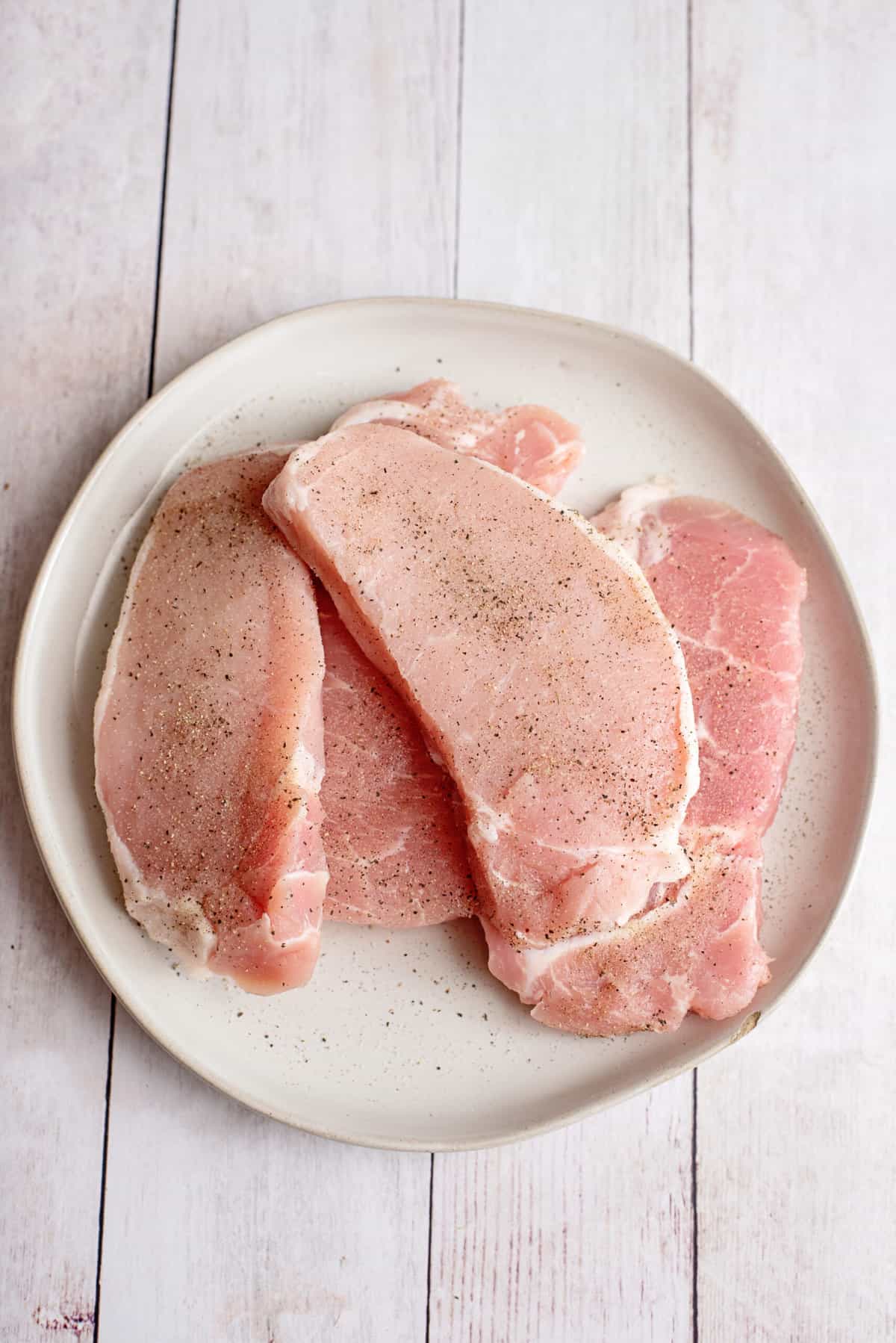 sprinkle each side of the pork chop in salt/pepper mixture