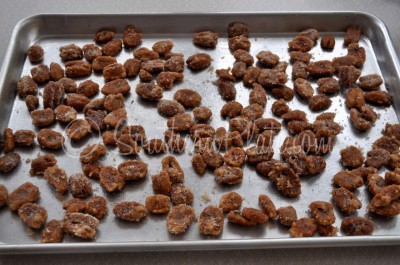 Candied pecans on the baking sheet.