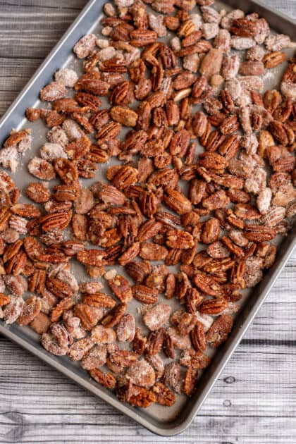 Candied pecans on baking sheet.