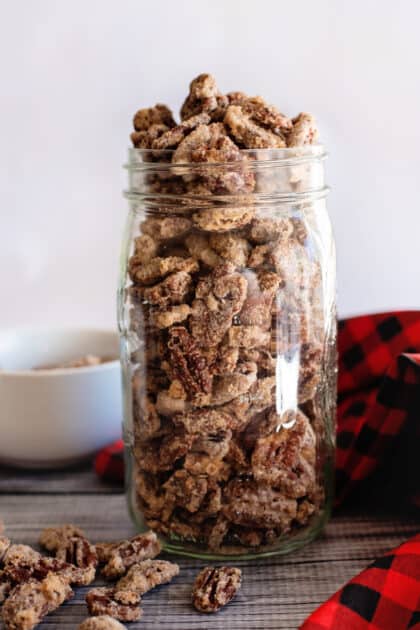 A jar overflowing with candied pecans.