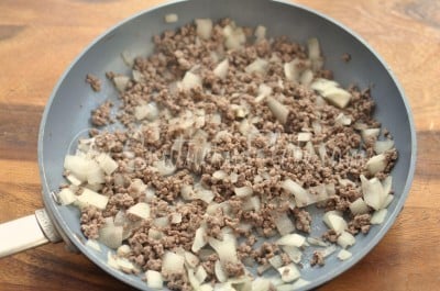 Brown beef and onion in skillet.