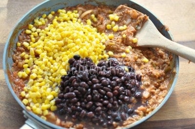 Add corn and black beans to skillet.