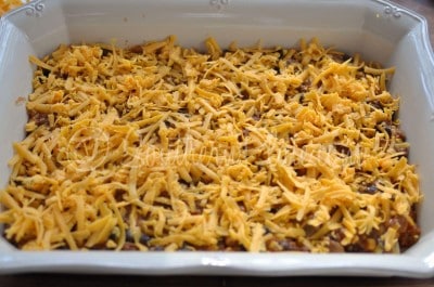 Top filling with half of the shredded cheese.