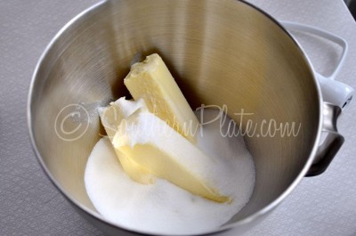 Beat butter and sugar in mixing bowl.