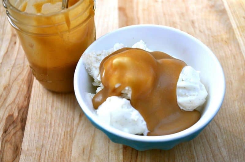 Peanut butter syrup served over vanilla ice cream.