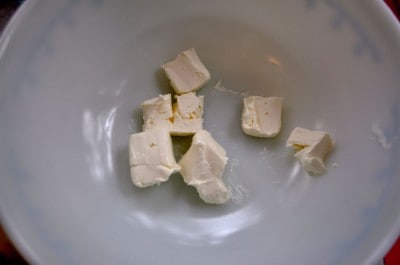 Place cream cheese cubes in mixing bowl and microwave to soften.