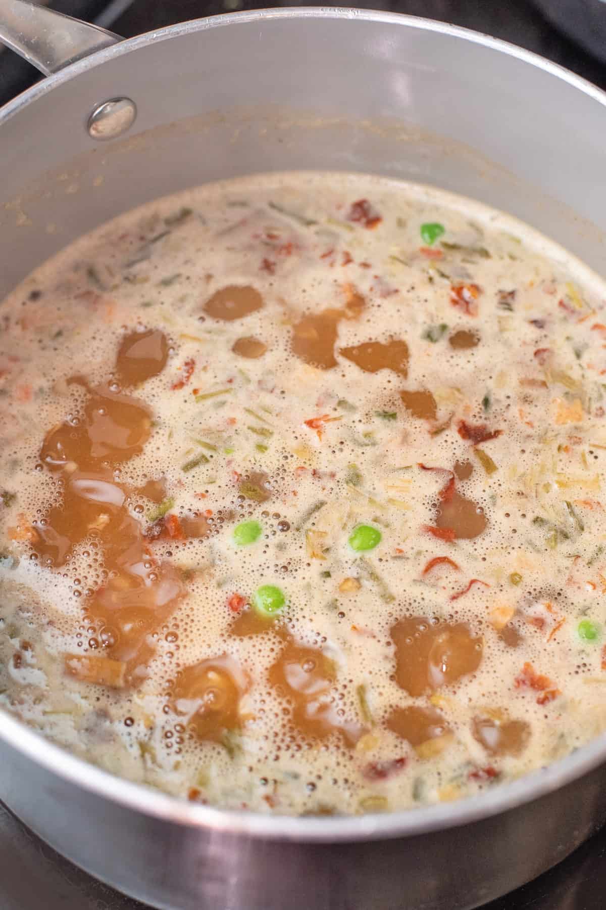 Boiling rice pilaf ingredients in a pot