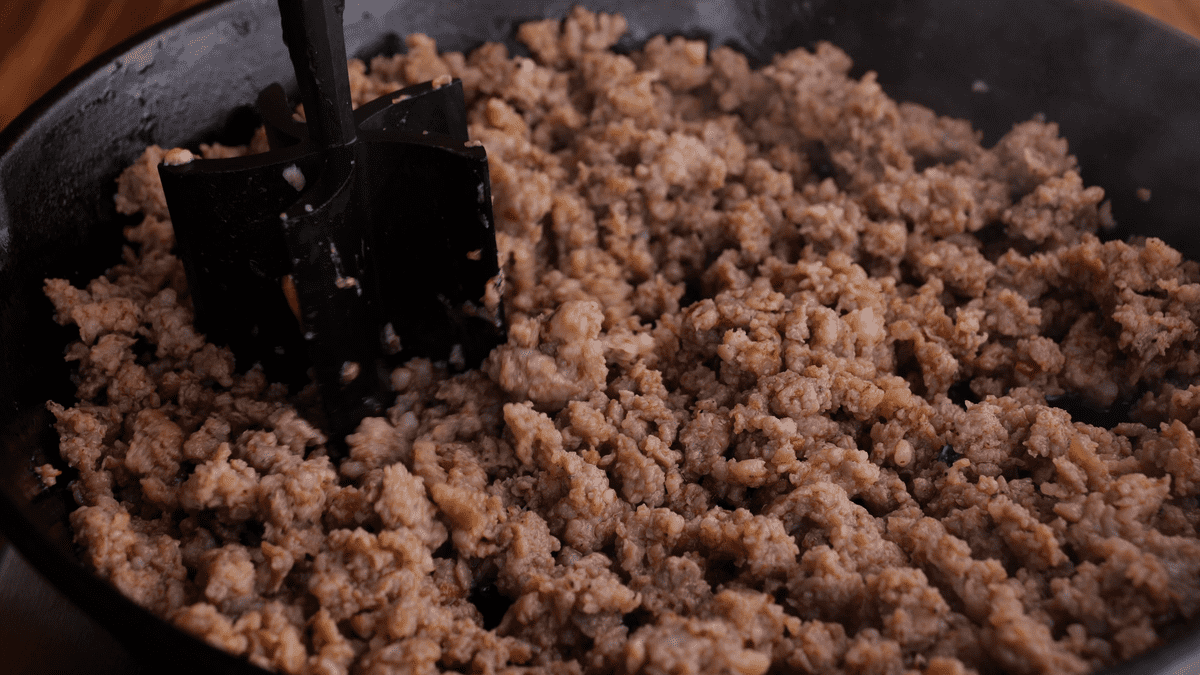 Browned sausage in a skillet.