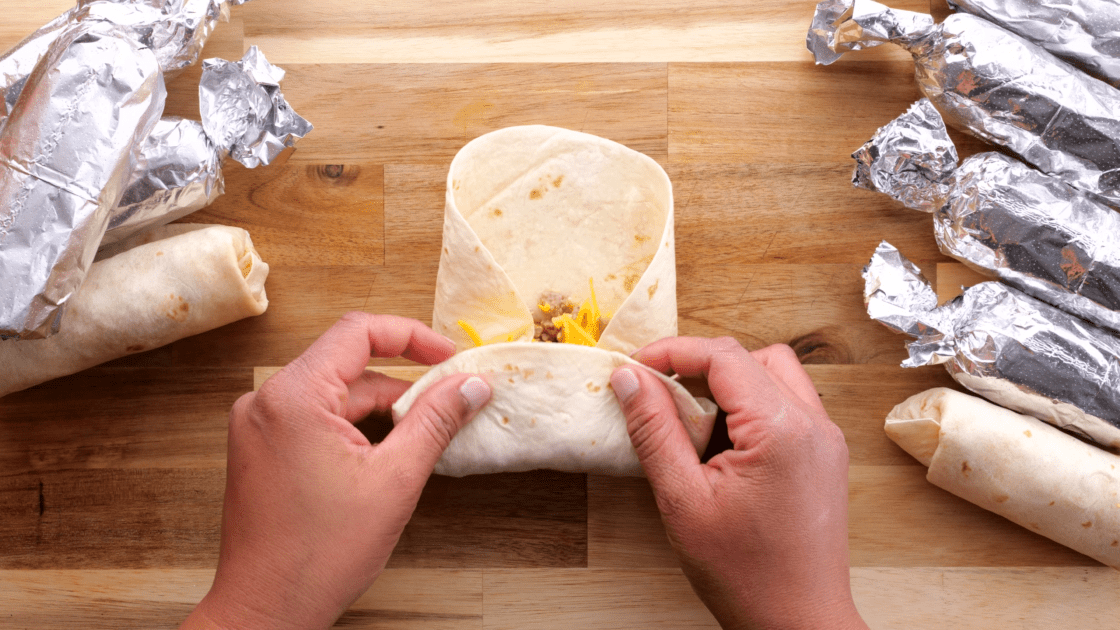 Fold up the bottom of your make-ahead breakfast burrito.