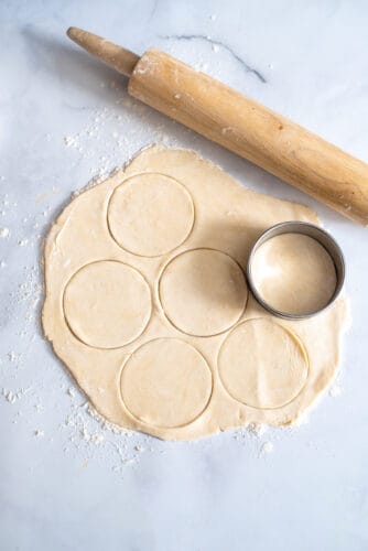 Cut dough with cookie cutter.
