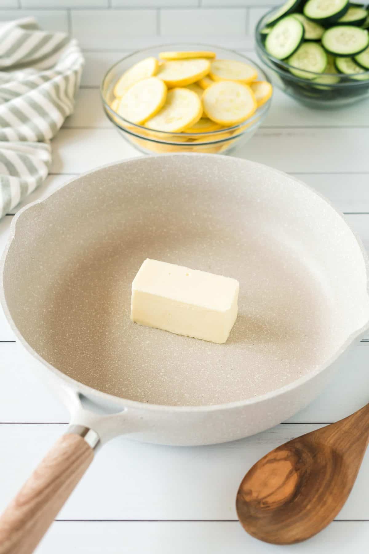 Butter in skillet for the simple zucchini and squash recipe