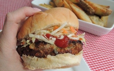 Hand holding a meatloaf burger.