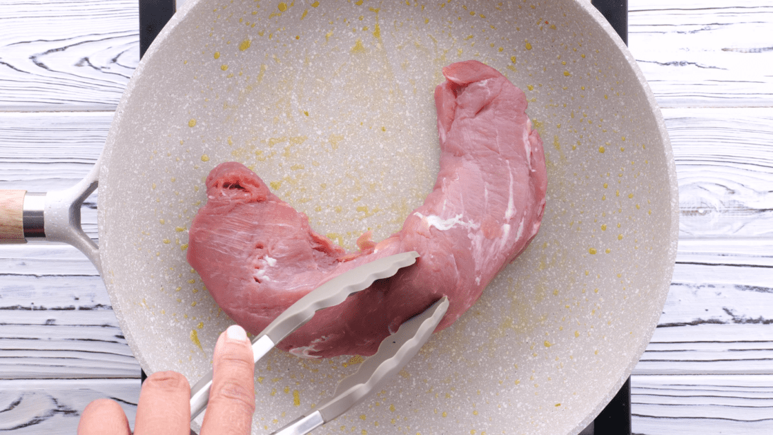 Add pork tenderloin to the skillet.
