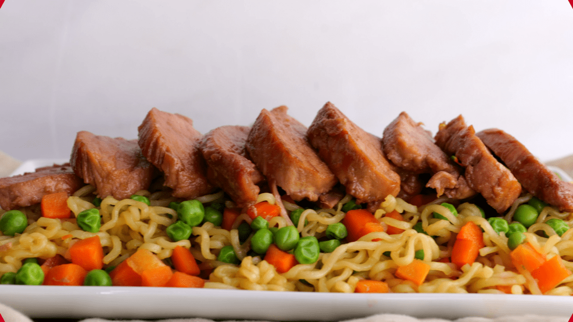 Serve pork tenderloin over noodles and vegetables.