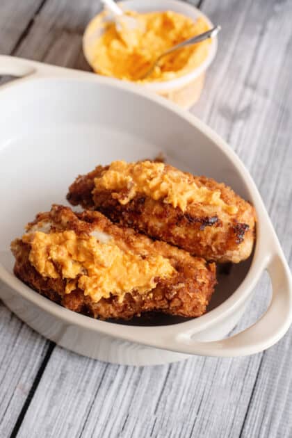 Pop chicken on sides in a baking dish and briefly bake in oven.