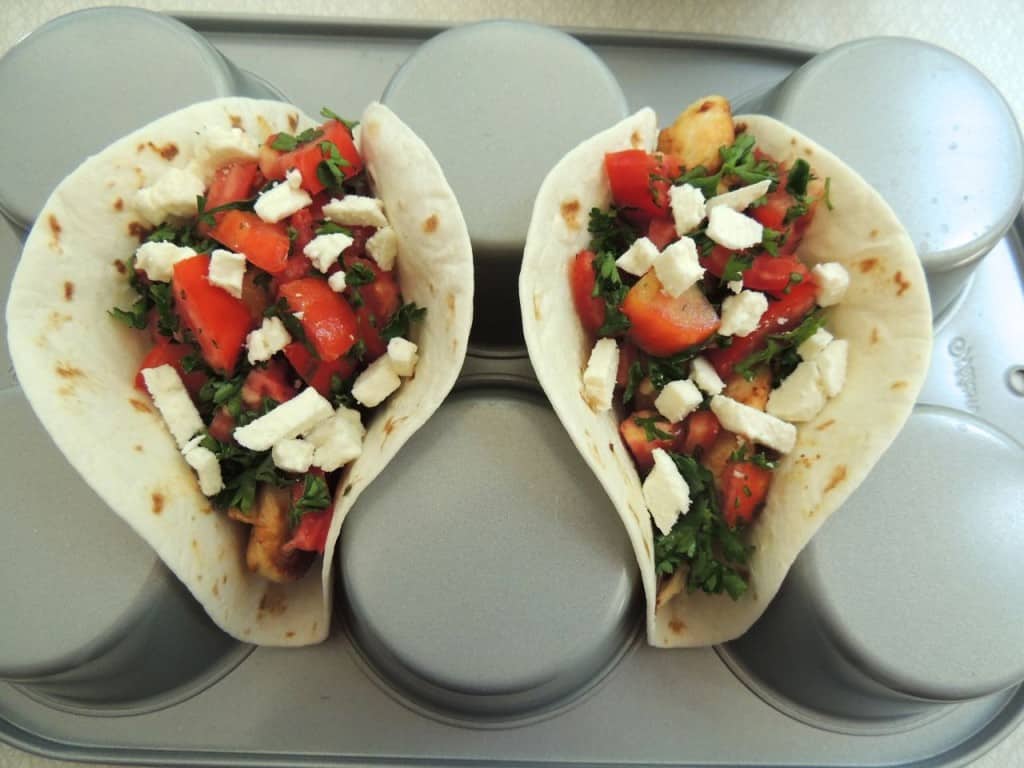 Add feta cheese to the Greek chicken tacos.