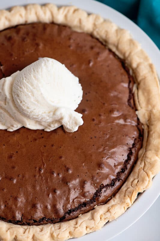 brownie pie topped with a scoop of ice cream.