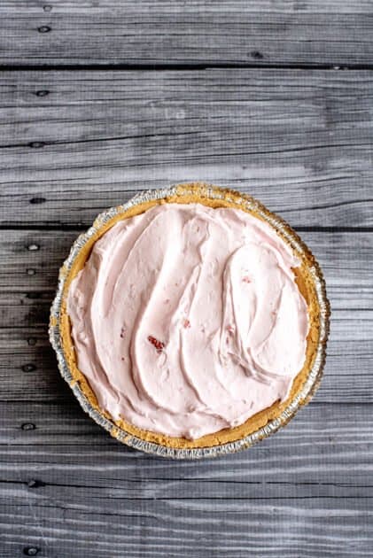 Spoon pie mixture into the graham cracker crust.