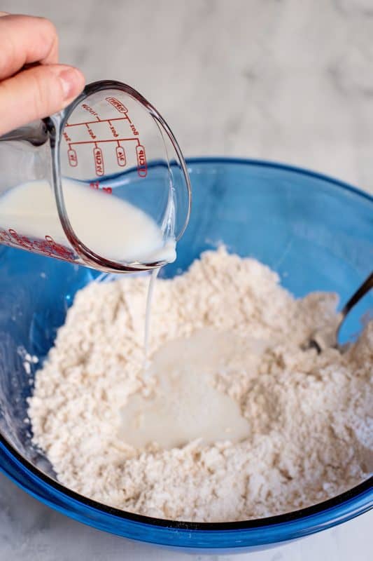 Pour milk into the flour mixture.