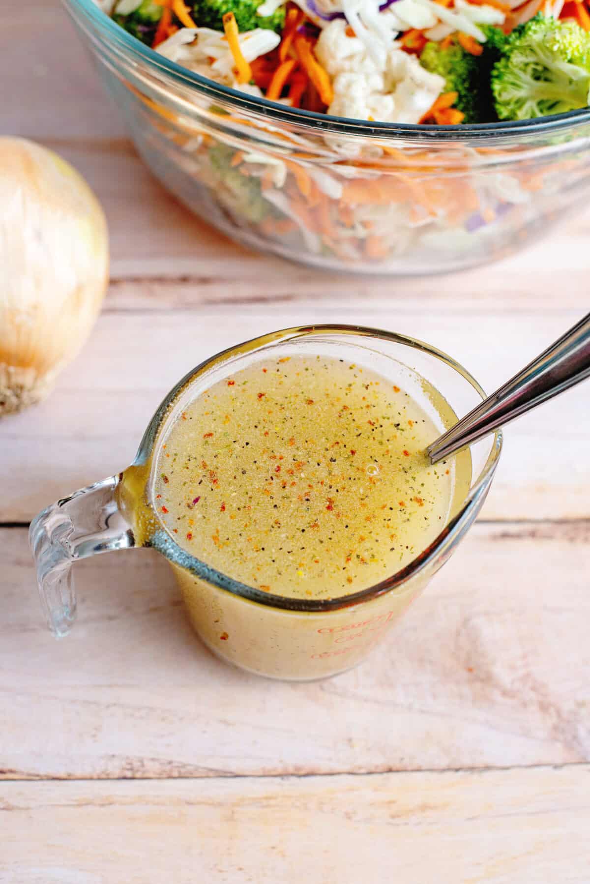Salad dressing in a measuring cup.