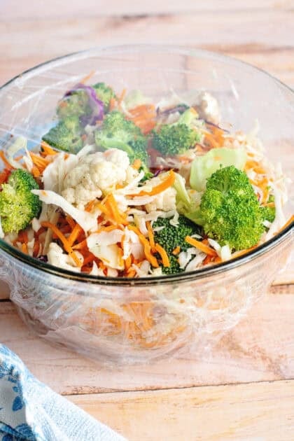 Refrigerator sitting at room temperature in a glass mixing bowl covered with plastic wrap.