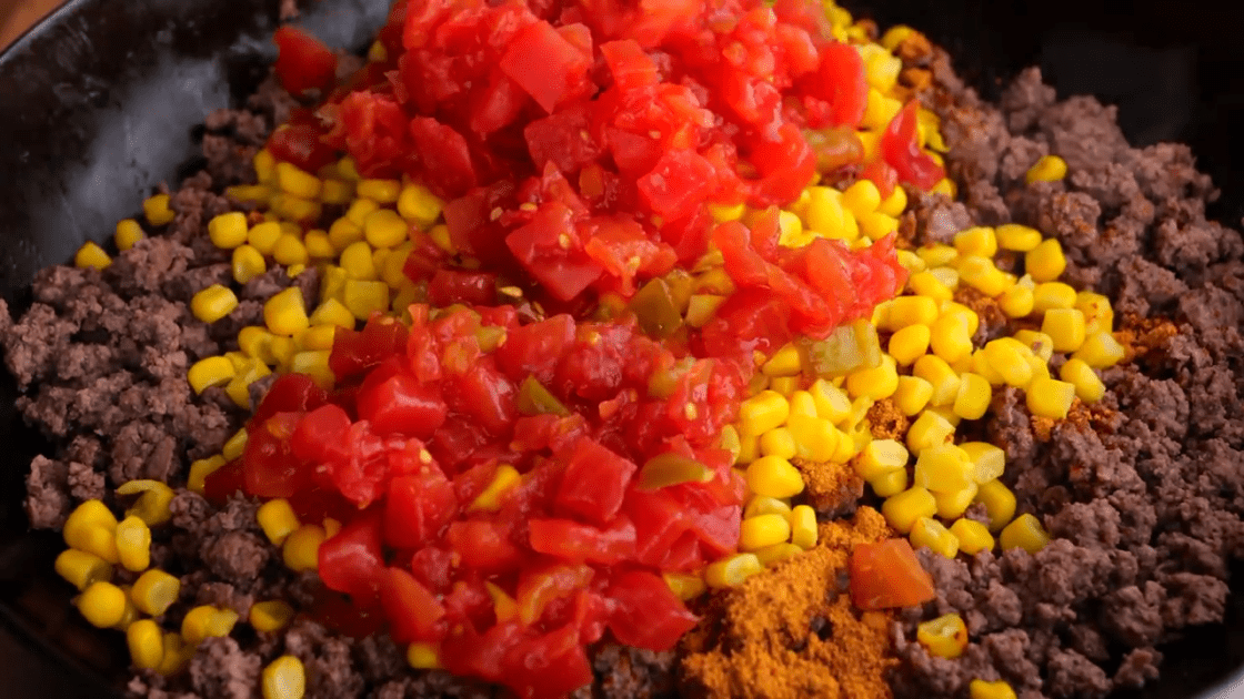 Add rotel tomatoes to ground beef.
