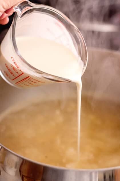 Add cream to stockpot.