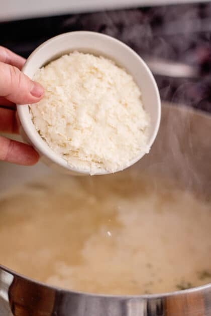 Add instant potato flakes to stockpot.