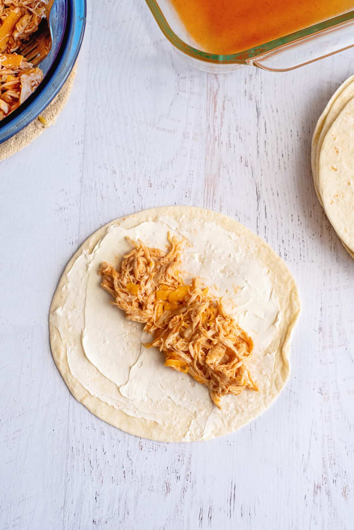 Place few tablespoons of chicken mixture on tortilla.