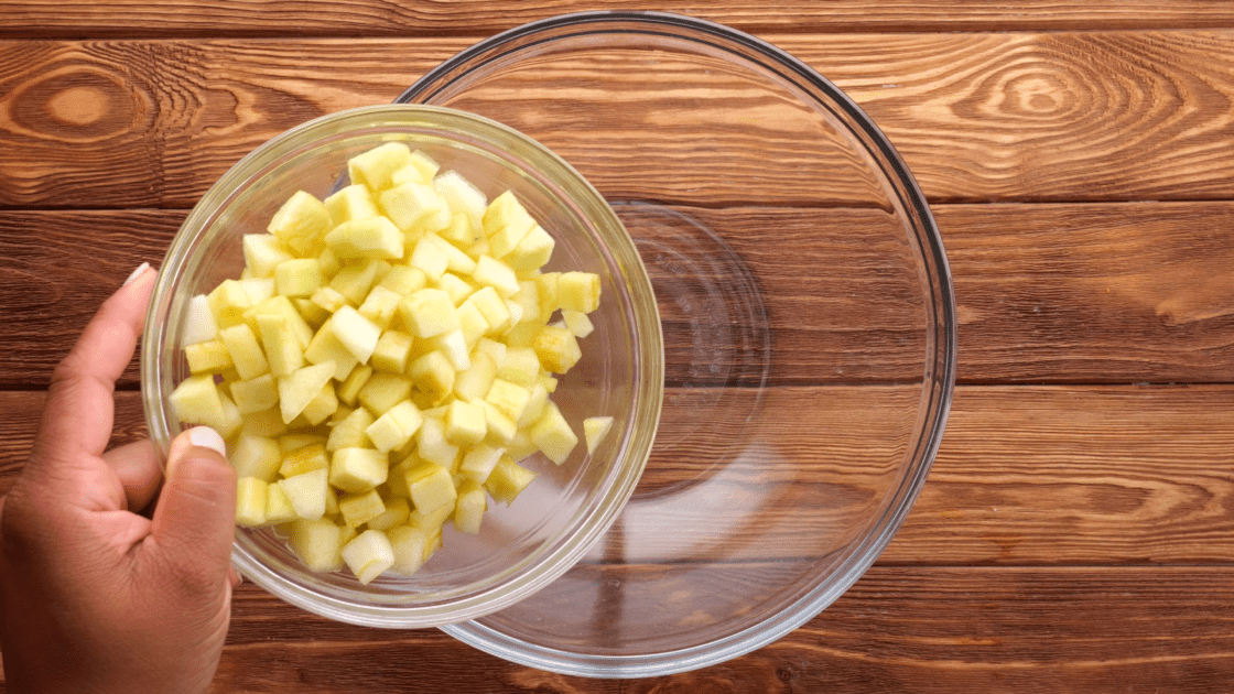 Place diced apples in a mixing bowl.