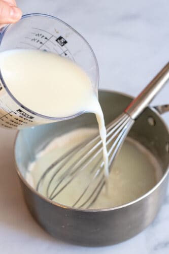 Add milk to saucepot and whisk well.