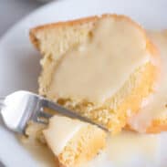 Fork breaking off piece of pound cake.