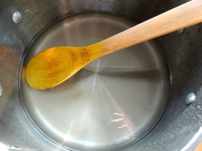 Sugar dissolved in water in saucepot.