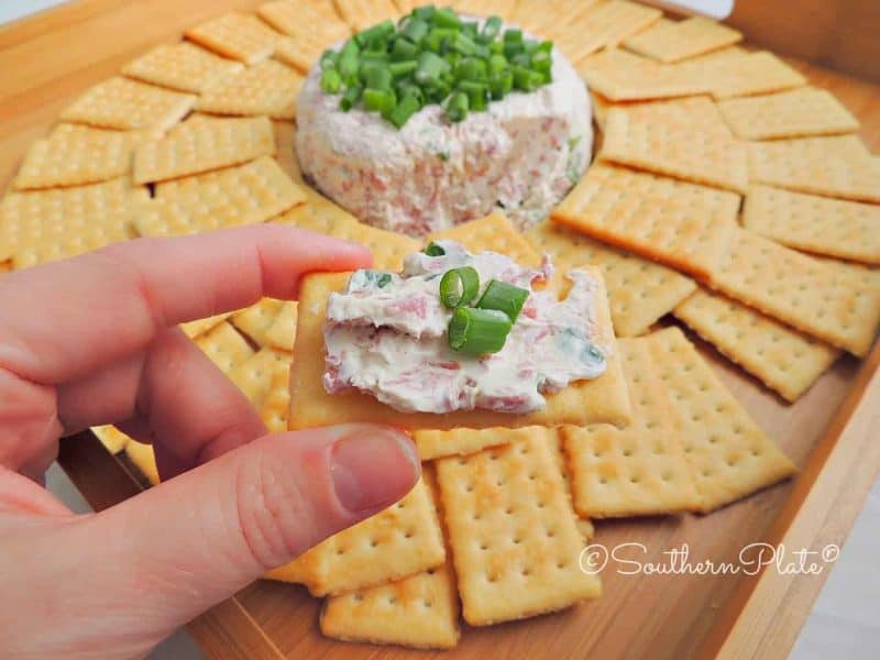 Reuben dip spread on a cracker.