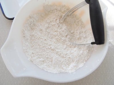 Flour and shortening combined in mixing bowl.