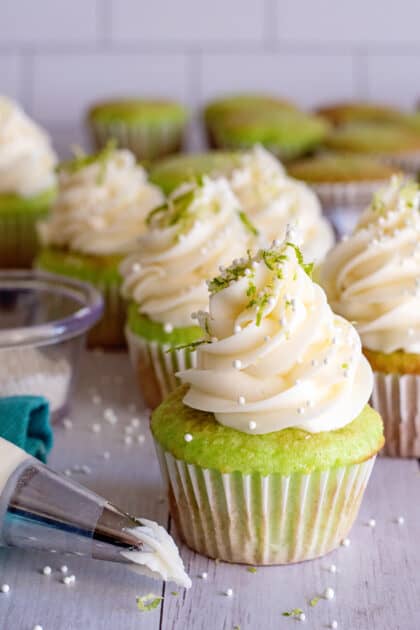 Decorate key lime cupcakes with zest.