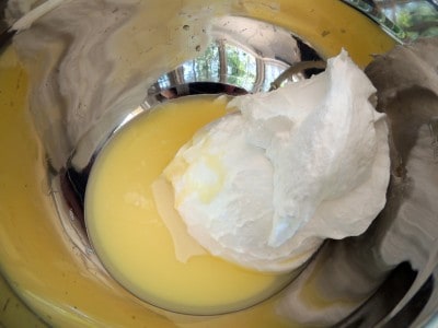 place sweetened condensed milk, lemon juice, and whipped topping in mixing bowl.