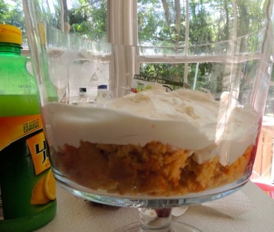 Top cake layer with half the whipped topping mixture.