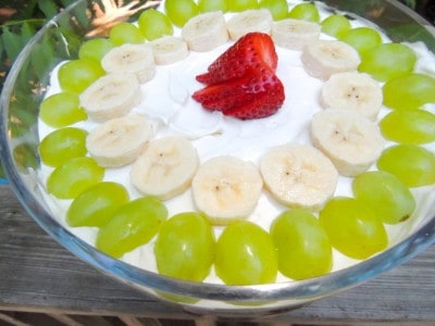 Add remaining whipped topping and then top with fruit.