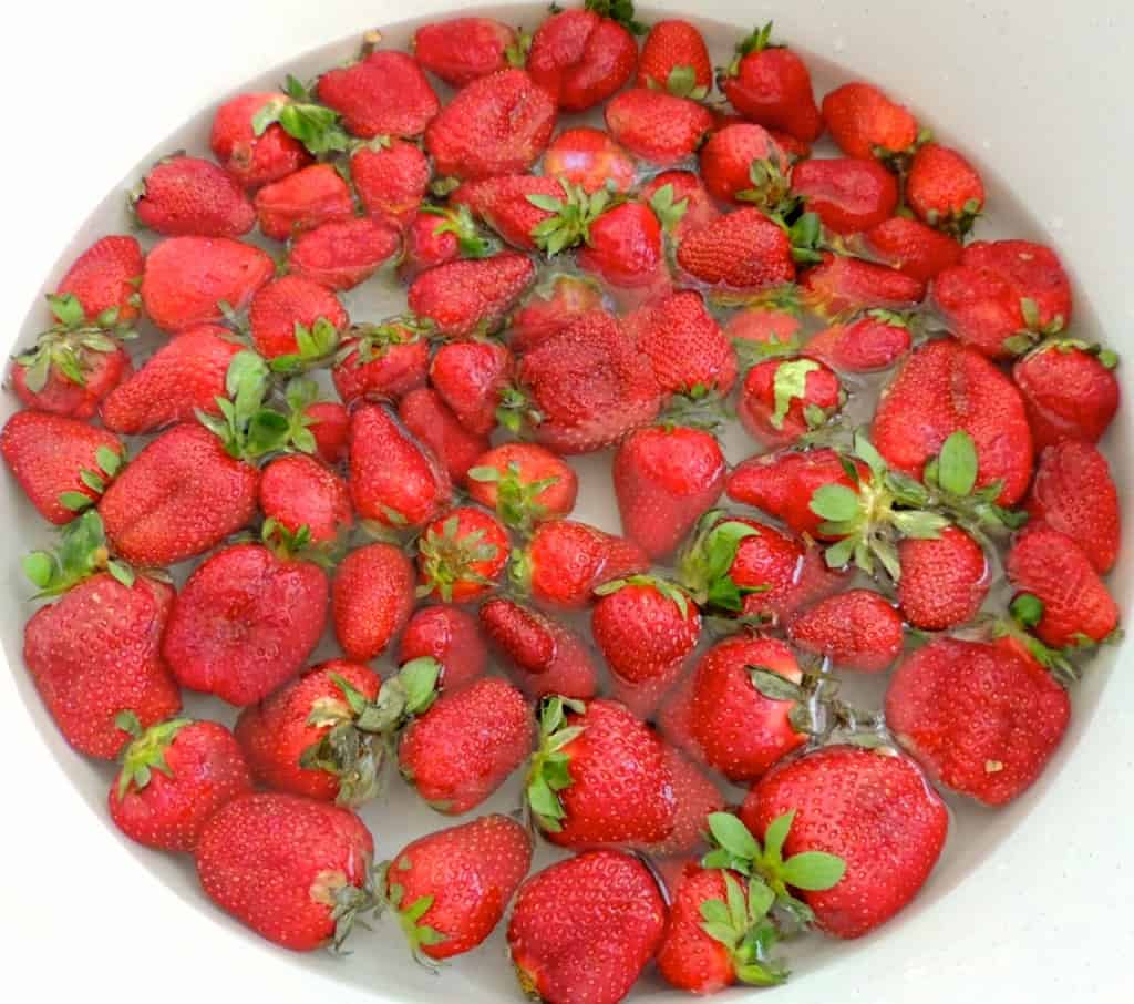 Wash strawberries.