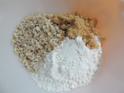 Mix your oats, brown sugar, and flour in a bowl.
