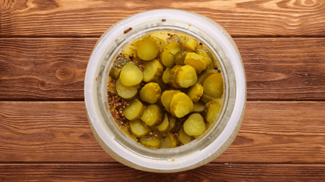 Add sliced pickles to jar.